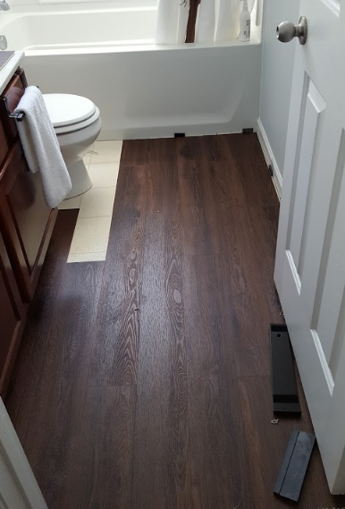 Laying Coretec Plus In A Bathroom, How To Cut Laminate Wood Flooring Around A Toilet